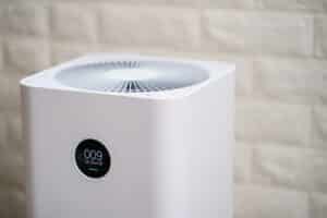 Closeup of Air purifier with monitor screen, show air quality in the room. PM2.5 concept.